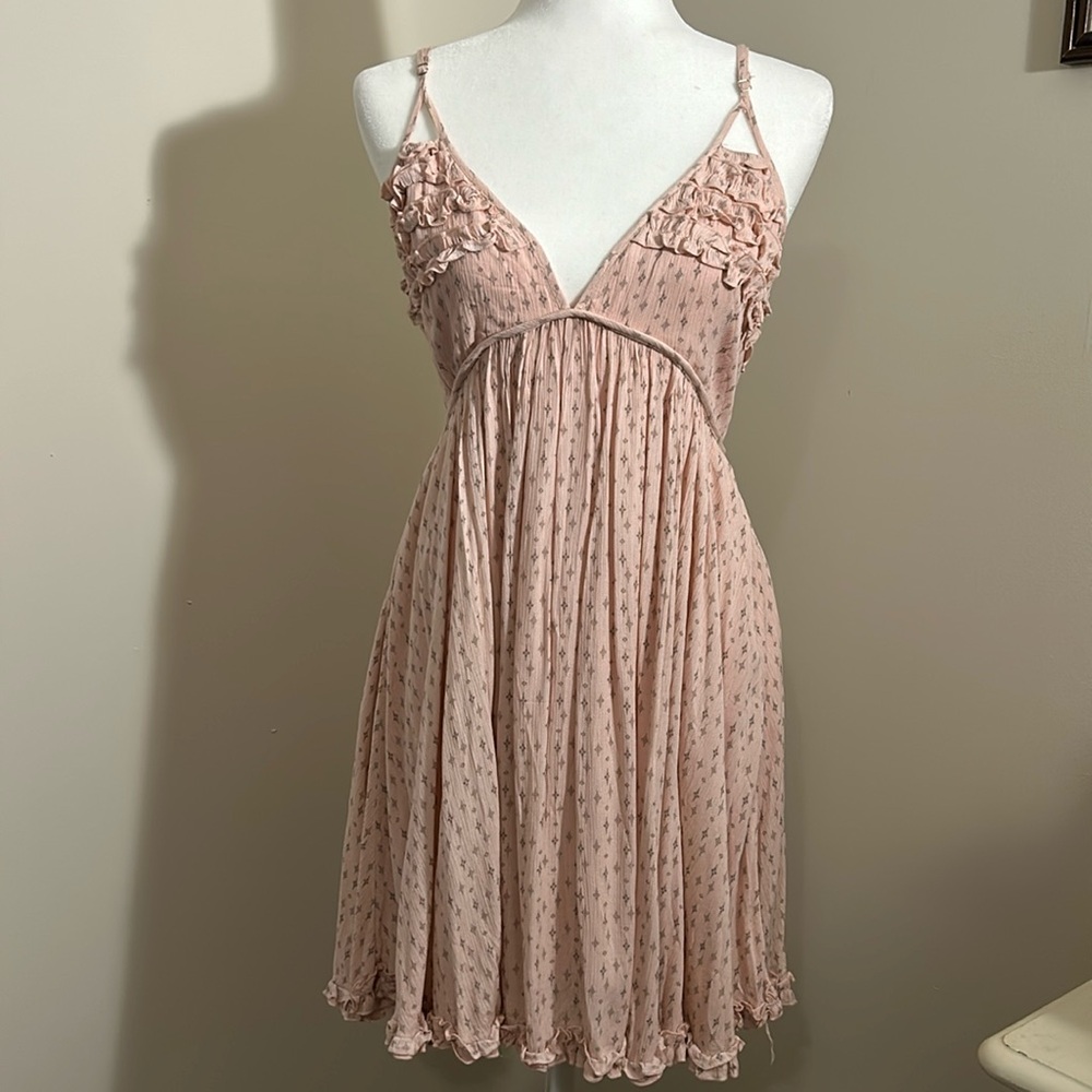 Pink doll dress with ruffle details black print diamonds